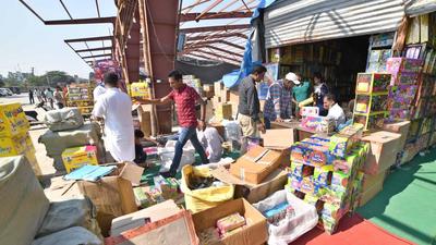 Ludhiana residents at a firecracker market near Grain Market, Jalandhar Bypass, in Ludhiana on Monday. The ban on normal crackers in Punjab is being violated with impunity. (Gurpreet Singh/HT) Ludhiana residents at a firecracker market near Grain Market, Jalandhar Bypass, in Ludhiana on Monday. The ban on normal crackers in Punjab is being violated with impunity. (Gurpreet Singh/HT)