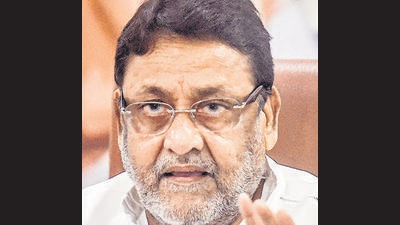 NCP leader and state minister Nawab Malik on Monday tweeted separate pictures of Jaydeep Rana, an alleged drug peddler, with former chief minister Devendra Fadnavis and his wife Amruta Fadnavis (PTI) NCP leader and state minister Nawab Malik on Monday tweeted separate pictures of Jaydeep Rana, an alleged drug peddler, with former chief minister Devendra Fadnavis and his wife Amruta Fadnavis (PTI)
