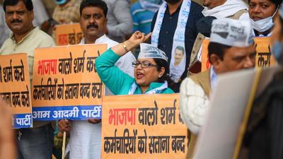 Aam Aadmi Party workers protest against the MCD over non-payment of salaries, at Civic Centre, in New Delhi on Monday. (Amal KS/HT Photo) Aam Aadmi Party workers protest against the MCD over non-payment of salaries, at Civic Centre, in New Delhi on Monday. (Amal KS/HT Photo)