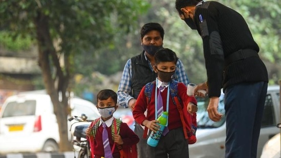 Students being thermally screened outside a school in Green Park in Delhi. (Amal KS/HT Photo)