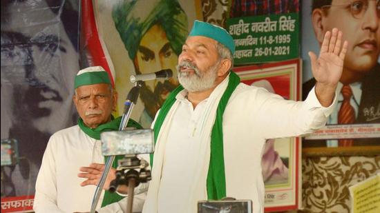 Bharatiya Kisan Union spokesperson Rakesh Tikait addresses farmers at the Ghazipur border in New Delhi. On Monday, he reiterated his threat to escalate the farmer protests. (PTI/File)