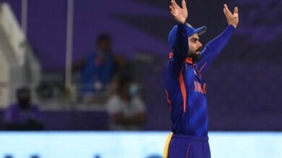 India's captain Virat Kohli places the fielders during the Cricket Twenty20 World Cup match against New Zealand in Dubai, UAE, Sunday, Oct. 31, 2021. (AP Photo/Aijaz Rahi)(AP)