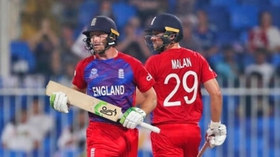 England's Jos Buttler, left, and Dawid Malan run between the wickets during the Cricket Twenty20 World Cup match between England and Sri Lanka in Sharjah, UAE, Monday, Nov. 1, 2021.&nbsp;(AP)