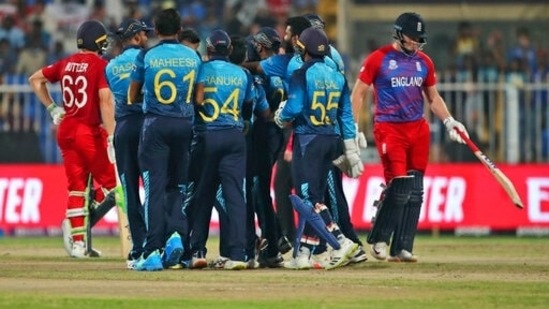 Sri Lankan players celebrate the dismissal of England's Jonny Bairstow, right, during the Cricket Twenty20 World Cup match between England and Sri Lanka in Sharjah, UAE, Monday, Nov. 1, 2021.(AP)