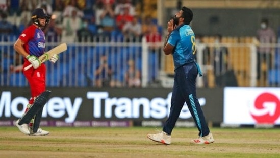 Sri Lanka's Lahiru Kumara, right, reacts after bowling a delivery to England's Jos Buttler, left, during the Cricket Twenty20 World Cup match between England and Sri Lanka in Sharjah, UAE,&nbsp;(AP)