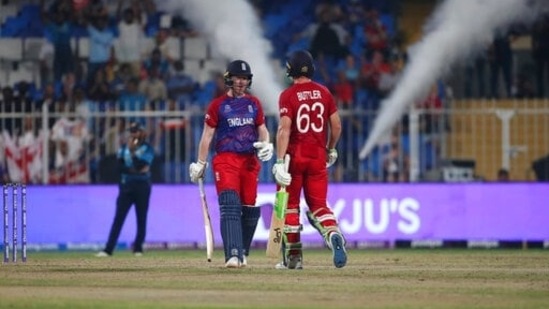 England's captain Eoin Morgan, left, celebrates with Jos Buttler after hitting a boundary during the Cricket Twenty20 World Cup match between England and Sri Lanka in Sharjah, UAE, Monday, Nov. 1, 2021.&nbsp;(AP)