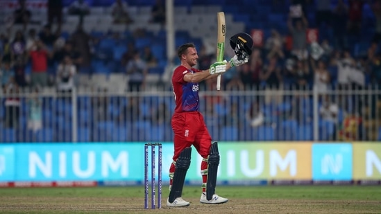 England's Jos Buttler celebrates after scoring a century during the Cricket Twenty20 World Cup match between England and Sri Lanka in Sharjah, UAE.(AP)