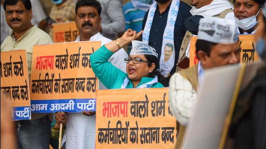 Aam Aadmi Party workers protest against the MCD over non-payment of salaries, at Civic Centre, in New Delhi on Monday. (Amal KS/HT Photo)
