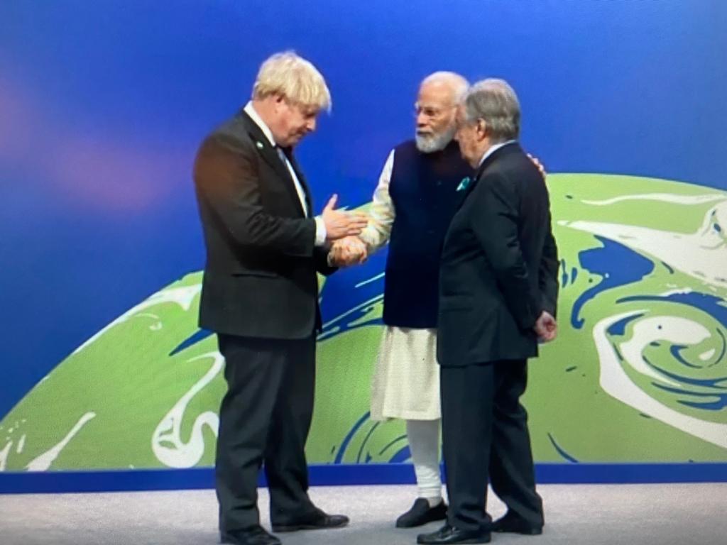 PM Modi greeted by UK Prime Minister Boris Johnson and UN Secretary General Antonio Guterres at the Scottish Exhibition Centre. PM Modi greeted by UK Prime Minister Boris Johnson and UN Secretary General Antonio Guterres at the Scottish Exhibition Centre.