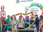 Union minister Sarbananda Sonowal with minister of state for Ayush Munjpara Mahendrabhai Kalubhai being welcomed during the 6th Ayurveda Day celebration function at National Institue of Ayurveda in Jaipur on Tuesday. (PTI)