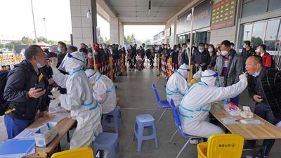 Health workers conduct Covid-19 tests on travellers at the exit of Yantai Railway Station in China’s eastern Shandong province on Tuesday. China’s top respiratory expert has said the country will not give up its zero-tolerance towards Covid-19 policy any time soon (AFP) Health workers conduct Covid-19 tests on travellers at the exit of Yantai Railway Station in China’s eastern Shandong province on Tuesday. China’s top respiratory expert has said the country will not give up its zero-tolerance towards Covid-19 policy any time soon (AFP)