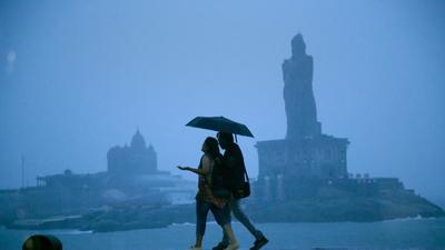 A file photo of pedestrians during heavy rain in Kanyakumari on October 30, 2021. (PTI)