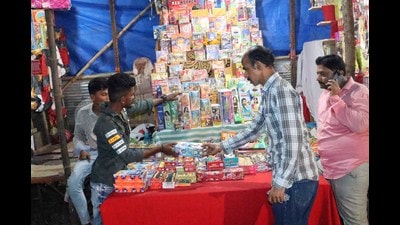A stall selling fireworks in Kalyan on Tuesday. The Kalyan Dombivli Municipal Corporation has given permission to 135 fireworks stalls at 12 open spaces in its jurisdiction ahead of Diwali. (RISHIKESH CHOUDHARY/HT PHOTO) A stall selling fireworks in Kalyan on Tuesday. The Kalyan Dombivli Municipal Corporation has given permission to 135 fireworks stalls at 12 open spaces in its jurisdiction ahead of Diwali. (RISHIKESH CHOUDHARY/HT PHOTO)