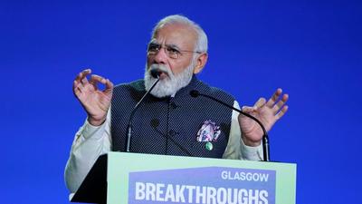 Prime Minister Narendra Modi delivers a speech during for a meeting, as part of the World Leaders' Summit of the COP26 UN Climate Change Conference in Glasgow on Tuesday. PM Modi launched ‘One Sun One World One Grid’ initiative (AFP) Prime Minister Narendra Modi delivers a speech during for a meeting, as part of the World Leaders' Summit of the COP26 UN Climate Change Conference in Glasgow on Tuesday. PM Modi launched ‘One Sun One World One Grid’ initiative (AFP)