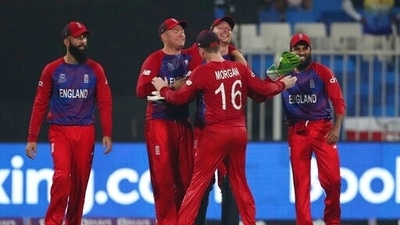 England's captain Eoin Morgan hugs Jos Buttler, second right, after the dismissal of Sri Lanka's captain Dasun Shanaka during the Cricket Twenty20 World Cup match between England and Sri Lanka in Sharjah, UAE, Monday, Nov. 1, 2021. (AP Photo/Aijaz Rahi) (AP) England's captain Eoin Morgan hugs Jos Buttler, second right, after the dismissal of Sri Lanka's captain Dasun Shanaka during the Cricket Twenty20 World Cup match between England and Sri Lanka in Sharjah, UAE, Monday, Nov. 1, 2021. (AP Photo/Aijaz Rahi) (AP)