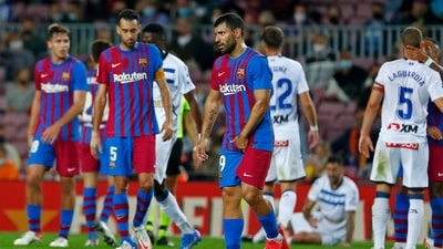 Barcelona's Sergio Aguero, center, leaves the pitch injured during the La Liga soccer match between Barcelona and Alaves at the Camp Nou stadium in Barcelona, Spain Saturday, Oct. 30, 2021. (AP Photo/Joan Monfort) (AP)