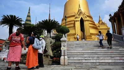 Foreign tourists visit the Grand Palace in Bangkok, Thailand a day after the country welcomed the first travellers vaccinated against the coronavirus disease to enter the country without the need for a two-week quarantine. (AFP) Foreign tourists visit the Grand Palace in Bangkok, Thailand a day after the country welcomed the first travellers vaccinated against the coronavirus disease to enter the country without the need for a two-week quarantine. (AFP)