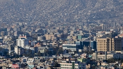 A photograph shows a general view of Kabul city, (Photo by Hector RETAMAL / AFP)