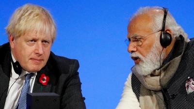 Indian Prime Minister Narendra Modi (right) and Britain's Prime Minister Boris Johnson talk during a session on the second day of the COP26 UN climate change summit in Glasgow on November 2, 2021. (AFP) Indian Prime Minister Narendra Modi (right) and Britain's Prime Minister Boris Johnson talk during a session on the second day of the COP26 UN climate change summit in Glasgow on November 2, 2021. (AFP)