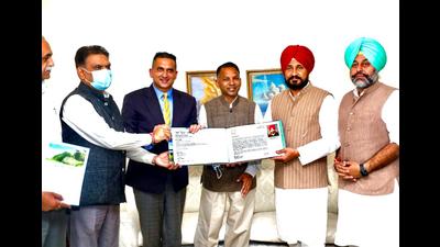 Punjab CM Charanjit Singh Channi (red turban) during the release of a coffee table book by Ludhiana-based lawyer Harpreet Sandhu (second from left). (HT photo)