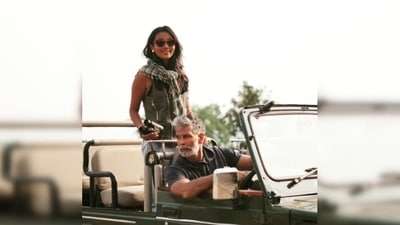 Milind Soman gives a candid pose from the driving seat of the gypsy while his wife Ankita Konwar stands and smiles for the camera.&nbsp; (Instagram/@milindrunning)