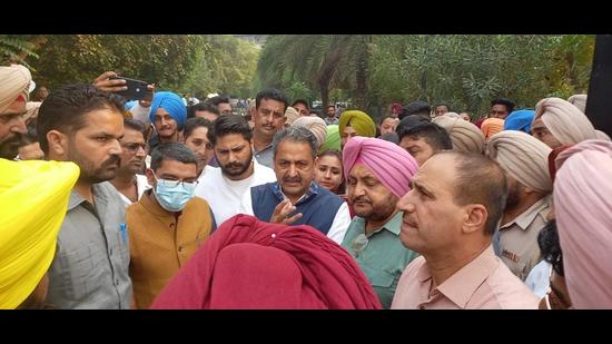 Punjab cabinet minister Vijay Inder Singla talking to farmers in the Sangrur district administration complex on Tuesday.