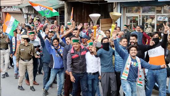 Himachal Congress workers celebrating their party’s win in Mandi bypoll on Tuesday. (BIRBAL SHARMA/HT)