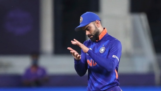 India's captain Virat Kohli applauds after the wicket of New Zealand's Daryl Mitchell during the Cricket Twenty20 World Cup match between New Zealand and India in Dubai, UAE, Sunday, Oct. 31, 2021. (AP Photo/Aijaz Rahi)(AP)