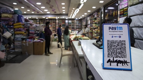 A clothes store displays the QR code for the Paytm digital payment system in Bengaluru.(Bloomberg Photo)