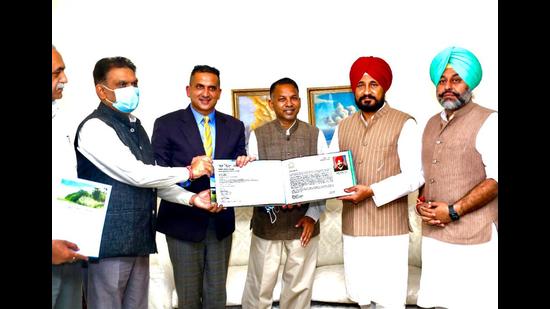 Punjab CM Charanjit Singh Channi (red turban) during the release of a coffee table book by Ludhiana-based lawyer Harpreet Sandhu (second from left). (HT photo)