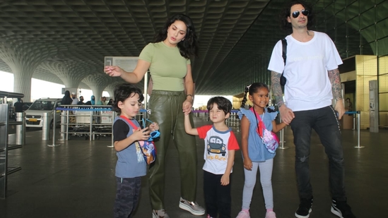 Sunny Leone, her husband Daniel Weber and their children Nisha, Noah and Asher were spotted at the Mumbai airport.(Varinder Chawla)