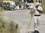 A policeman stands guard at a designated namaz site in Sector 47 in October, following protests and threats by right-wing Hindu groups. (Vipin Kumar/HT PHOTO) A policeman stands guard at a designated namaz site in Sector 47 in October, following protests and threats by right-wing Hindu groups. (Vipin Kumar/HT PHOTO)