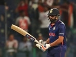 India's Rohit Sharma reacts after scoring 50 runs during the Cricket Twenty20 World Cup match between India and Afghanistan in Abu Dhabi, UAE, Wednesday, Nov. 3, 2021.(AP) India's Rohit Sharma reacts after scoring 50 runs during the Cricket Twenty20 World Cup match between India and Afghanistan in Abu Dhabi, UAE, Wednesday, Nov. 3, 2021.(AP)
