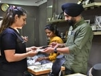 A woman buying jewellery at a shop on Dhanteras in Ludhiana on Tuesday.(Harsimar Pal Singh/HT Photo) A woman buying jewellery at a shop on Dhanteras in Ludhiana on Tuesday.(Harsimar Pal Singh/HT Photo)