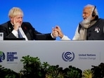 Britain's Prime Minister Boris Johnson and India's Prime Minister Narendra Modi attend a meeting during the UN Climate Change Conference COP26 in Glasgow, Scotland, on Tuesday. (AP) Britain's Prime Minister Boris Johnson and India's Prime Minister Narendra Modi attend a meeting during the UN Climate Change Conference COP26 in Glasgow, Scotland, on Tuesday. (AP)