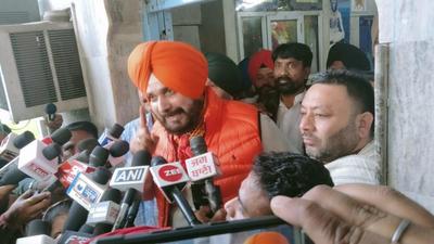Punjab Congress chief Navjot Singh Sidhu talking to reporters after inaugurating a development project at the Ram Talai Temple in Amritsar on Wednesday. (Sameer Sehgal/HT) Punjab Congress chief Navjot Singh Sidhu talking to reporters after inaugurating a development project at the Ram Talai Temple in Amritsar on Wednesday. (Sameer Sehgal/HT)