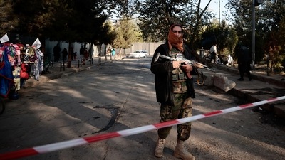 A Taliban fighter stands guard at the cordoned off area after yesterday's blasts and gunfire, beside the military hospital in Kabul, Afghanistan November 3, 2021.&nbsp; (REUTERS)
