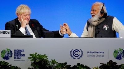 Britain's Prime Minister Boris Johnson and India's Prime Minister Narendra Modi attend a meeting during the UN Climate Change Conference COP26 in Glasgow, Scotland, on Tuesday.&nbsp; (AP)