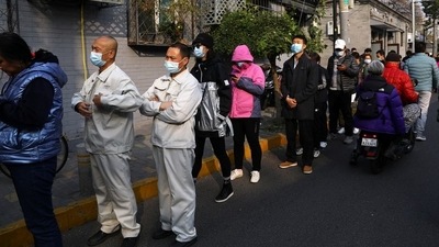 People line up outside a vaccination centre in Beijing after the city started offering booster shots of Covid-19 vaccine. (Reuters File Photo)