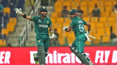 Pakistan's captain Babar Azam, right, and Mohammad Rizwan run between wickets during the Cricket Twenty20 World Cup match between Pakistan and Namibia in Abu Dhabi, UAE, Tuesday, Nov. 2, 2021. (AP Photo/Aijaz Rahi) (AP) Pakistan's captain Babar Azam, right, and Mohammad Rizwan run between wickets during the Cricket Twenty20 World Cup match between Pakistan and Namibia in Abu Dhabi, UAE, Tuesday, Nov. 2, 2021. (AP Photo/Aijaz Rahi) (AP)