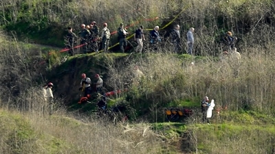 Investigators work the scene of a helicopter crash that killed former NBA basketball player Kobe Bryant, his 13-year-old daughter, Gianna, and several others Monday, Jan. 27, 2020, in Calabasas, Calif. (File image) (AP) Investigators work the scene of a helicopter crash that killed former NBA basketball player Kobe Bryant, his 13-year-old daughter, Gianna, and several others Monday, Jan. 27, 2020, in Calabasas, Calif. (File image) (AP)