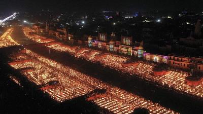 An aerial view of illuminated Saryu ghat with earthen lamps celebrating Deepotsav, in Ayodhya on Wednesday. (ANI Photo)