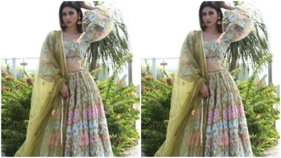 Styled by fashion stylist Rishika Devnani, Mouni left her straight long tresses open with a middle part. (Instagram/@imouniroy)