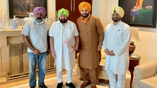 Punjab Congress president Navjot Singh Sidhu and his aide Pargat Singh (extreme left) calling on Capt Amarinder Singh at his farmhouse near Chandigarh before he stepped down as chief minister in September. (HT file photo) Punjab Congress president Navjot Singh Sidhu and his aide Pargat Singh (extreme left) calling on Capt Amarinder Singh at his farmhouse near Chandigarh before he stepped down as chief minister in September. (HT file photo)