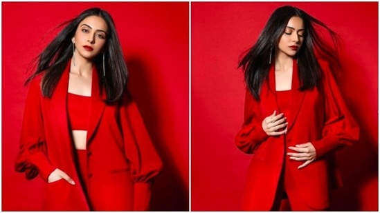 Several Bollywood celebrities have been spotted acing the pantsuit look. Rakul Preet, whose fashion game is always on point, took to her Instagram handle to share a few photos of herself in a breathtaking red pantsuit.(Instagram/@rakulpreet)