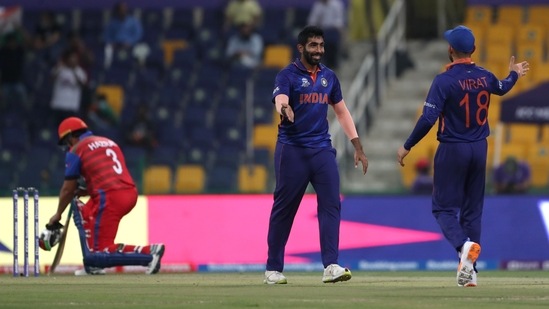 Abu Dhabi, Nov 03 (ANI): India's Jasprit Bumrah celebrates the wicket of Afghanistan's Hazratullah Zazai with team mate Virat Kohli during the ICC Mens T20 World Cup 2021 match between India and Afghanistan, at Sheikh Zayed Stadium in Abu Dhabi on Wednesday. (ANI Photo)(ANI)