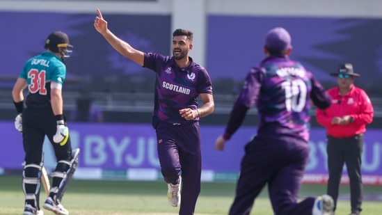 Dubai: Scotland's Safyaan Sharif, centre, celebrates after dismissing New Zealand's captain Kane Williamson during the Cricket Twenty20 World Cup match between New Zealand and Scotland in Dubai, UAE, Wednesday, Nov. 3, 2021. AP/PTI(AP11_03_2021_000122A)(AP)