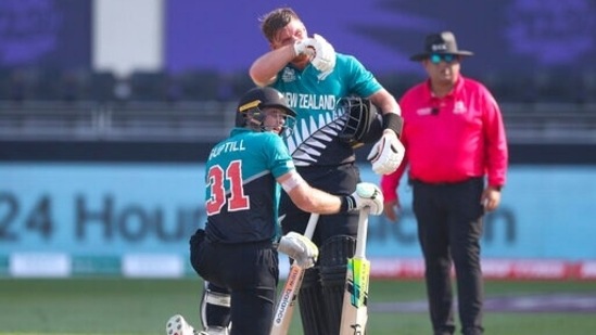 New Zealand's Martin Guptill, left, rests on his bat as teammate Glenn Phillips watches during the Cricket Twenty20 World Cup match between New Zealand and Scotland in Dubai, UAE, Wednesday, Nov. 3, 2021. (AP Photo/Kamran Jebreili)(AP)