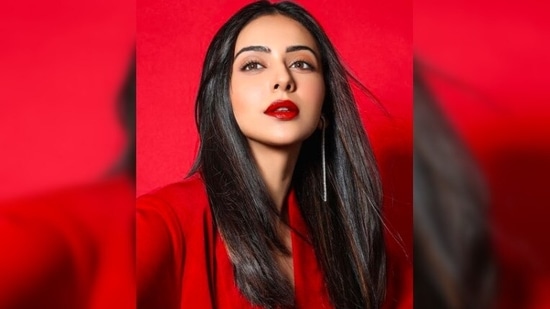 Rakul Preet teamed her bold attire with a pair of long silver earrings which completed her look.(Instagram/@rakulpreet)