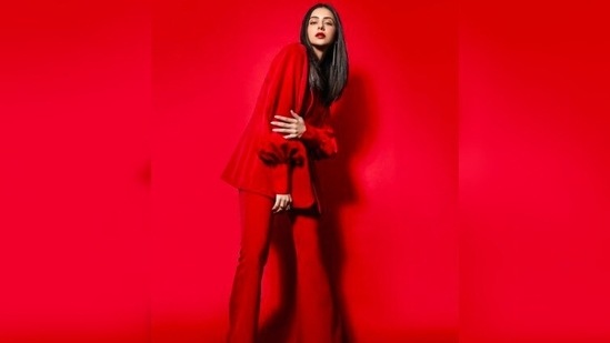 Rakul Preet gave off major boss lady vibes in this stunning red pantsuit with puffed sleeves and flared at the bottom pants.(Instagram/@rakulpreet)